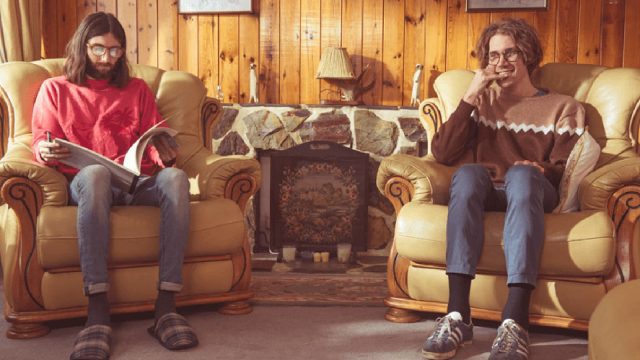 Art of Foley two cast members sitting on chairs