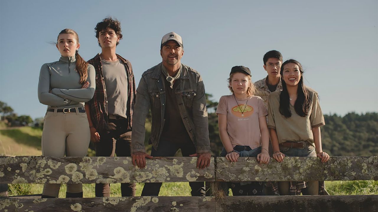 A group of people leaning on a fench for the program Mystic